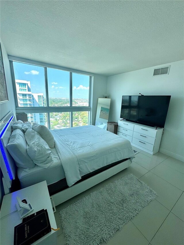 bedroom featuring visible vents and a textured ceiling