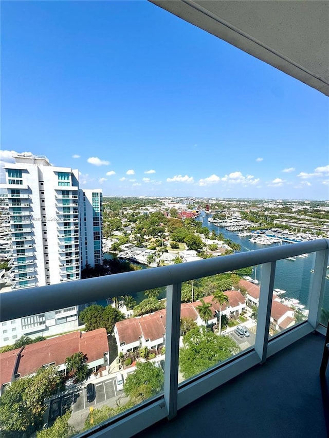 balcony with a view of city and a water view