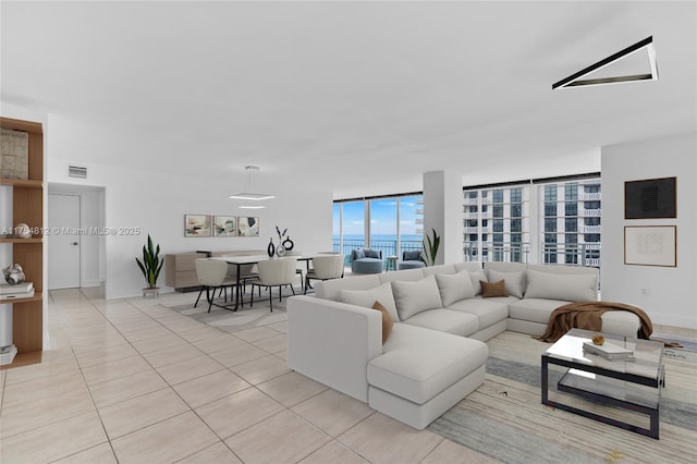 600 Grapetree Dr Unit 8Cs, Key Biscayne, FL 33149 - living area featuring light tile patterned floors and baseboards