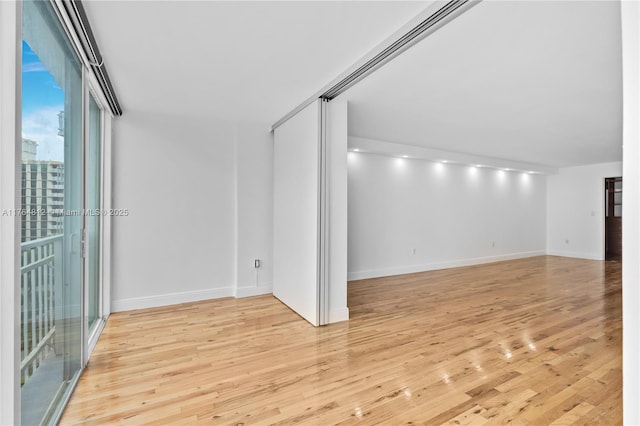 600 Grapetree Dr Unit 8Cs, Key Biscayne, FL 33149 - spare room with wood finished floors and baseboards