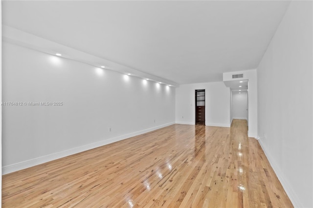 600 Grapetree Dr Unit 8Cs, Key Biscayne, FL 33149 - unfurnished living room with light wood finished floors and baseboards