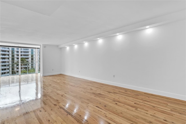 600 Grapetree Dr Unit 8Cs, Key Biscayne, FL 33149 - unfurnished room featuring light wood-style floors, baseboards, and recessed lighting