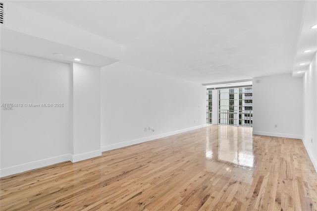 600 Grapetree Dr Unit 8Cs, Key Biscayne, FL 33149 - unfurnished room with light wood-style floors, baseboards, and recessed lighting
