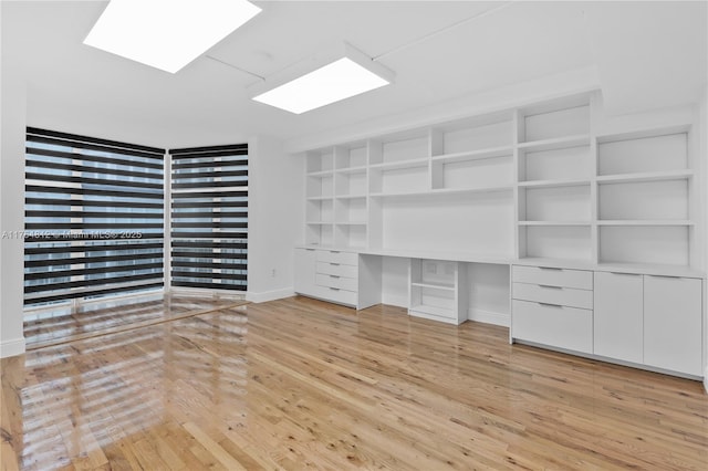 600 Grapetree Dr Unit 8Cs, Key Biscayne, FL 33149 - walk in closet featuring light wood-style floors and built in study area