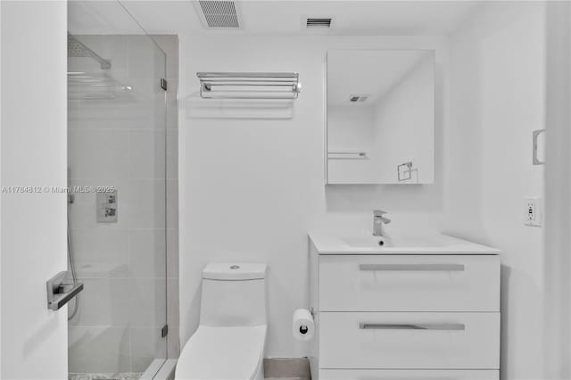 600 Grapetree Dr Unit 8Cs, Key Biscayne, FL 33149 - bathroom with a shower stall, vanity, and toilet