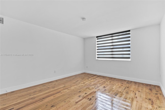 600 Grapetree Dr Unit 8Cs, Key Biscayne, FL 33149 - unfurnished room with wood finished floors, baseboards, and a smoke detector
