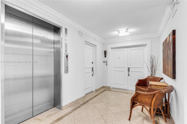 600 Grapetree Dr Unit 8Cs, Key Biscayne, FL 33149 - entryway featuring elevator, a textured ceiling, ornamental molding, inlaid floor details, and baseboards
