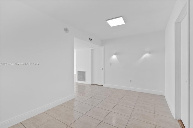 600 Grapetree Dr Unit 8Cs, Key Biscayne, FL 33149 - empty room featuring light tile patterned flooring and baseboards