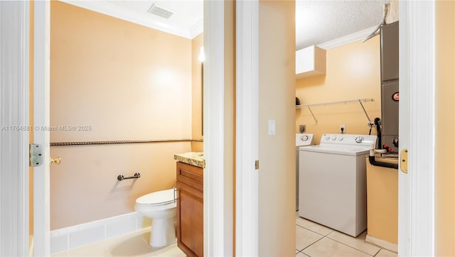 323 SW 190th Ter, Pembroke Pines, FL 33029 - bathroom featuring washer / dryer, vanity, crown molding, tile patterned flooring, and toilet