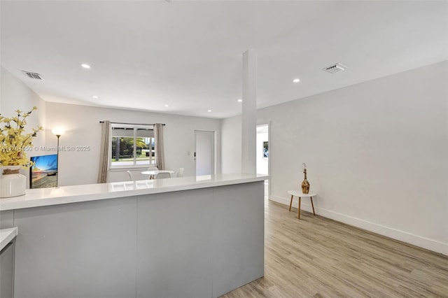 843 SW 20th St, Fort Lauderdale, FL 33315 - kitchen with recessed lighting, visible vents, light wood-style flooring, and light countertops