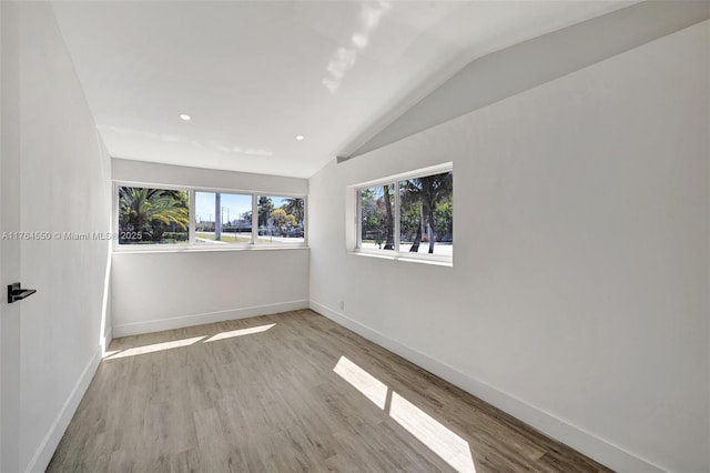 843 SW 20th St, Fort Lauderdale, FL 33315 - spare room with recessed lighting, wood finished floors, baseboards, and vaulted ceiling