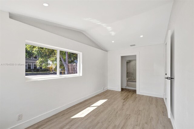 843 SW 20th St, Fort Lauderdale, FL 33315 - unfurnished bedroom featuring wood finished floors, baseboards, visible vents, recessed lighting, and vaulted ceiling