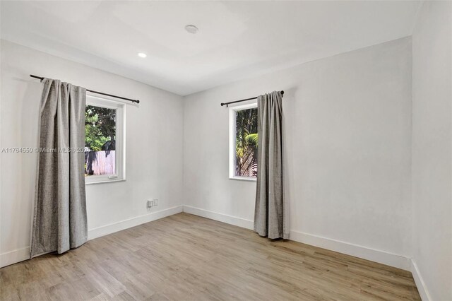 843 SW 20th St, Fort Lauderdale, FL 33315 - empty room featuring plenty of natural light, light wood-type flooring, and baseboards