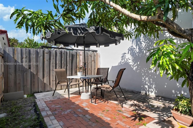 view of patio with fence