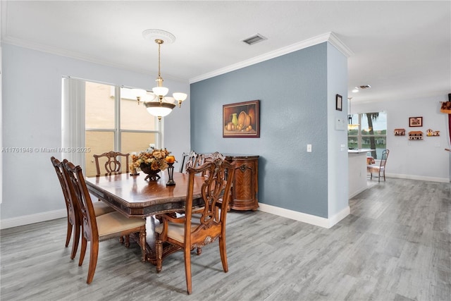 4261 SW 126th Ave, Miramar, FL 33027 - dining room with a chandelier, light wood-style floors, ornamental molding, and baseboards