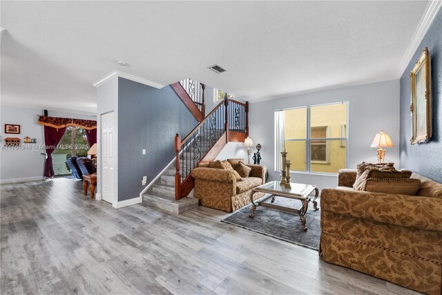 4261 SW 126th Ave, Miramar, FL 33027 - living area featuring ornamental molding, stairs, wood finished floors, and baseboards