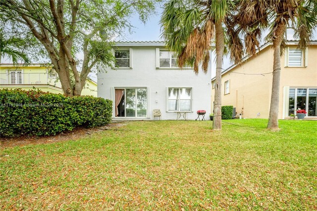 4261 SW 126th Ave, Miramar, FL 33027 - rear view of house with stucco siding and a lawn
