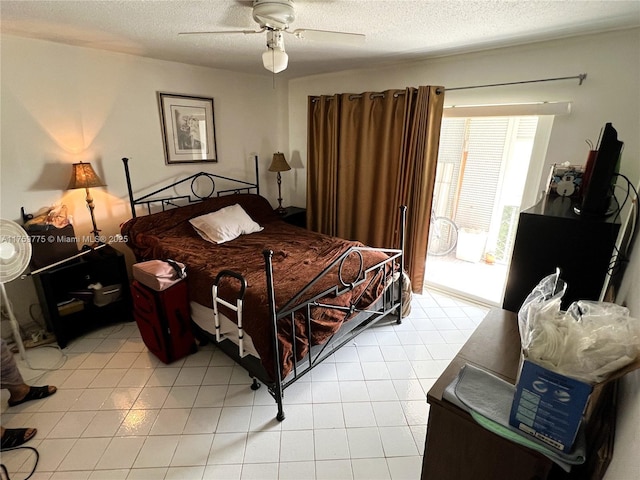 bedroom featuring a textured ceiling and ceiling fan