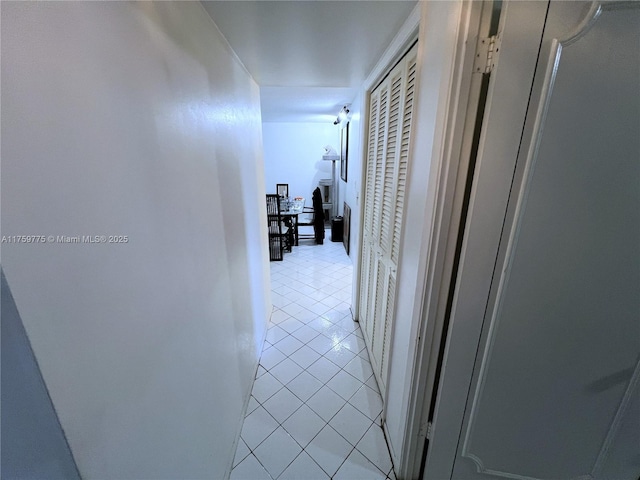 hallway featuring light tile patterned flooring