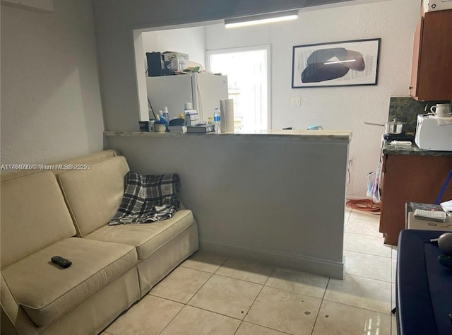 living room featuring light tile patterned floors