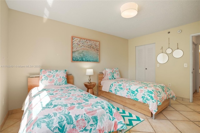 19555 E Country Club Dr Unit 8502, Aventura, FL 33180 - bedroom with light tile patterned flooring and a closet