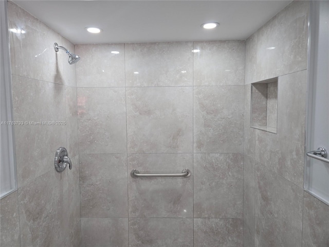 interior details featuring recessed lighting and tiled shower