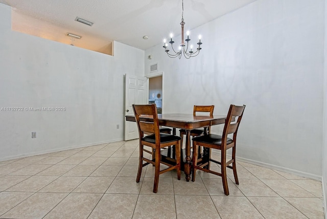 dining area with a notable chandelier, light tile patterned flooring, and visible vents