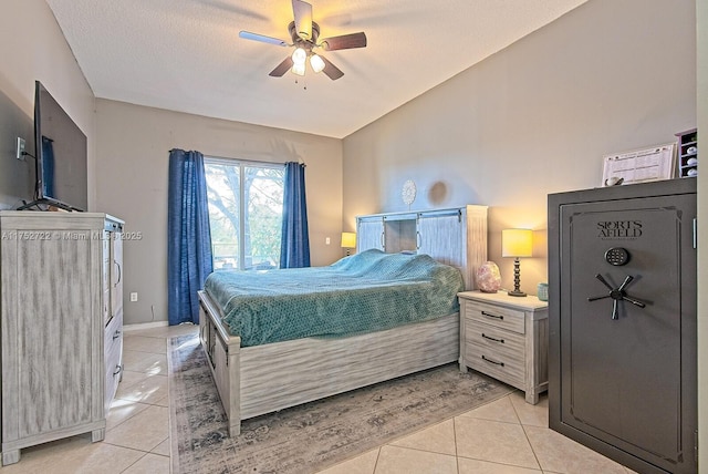 bedroom featuring light tile patterned floors and a ceiling fan