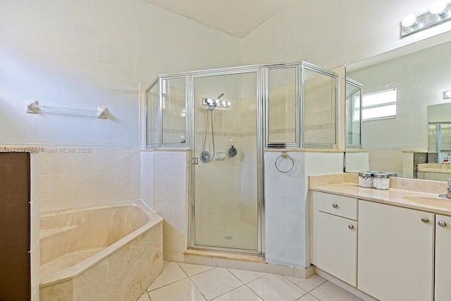 full bath with tile patterned floors, a shower stall, lofted ceiling, a bath, and vanity