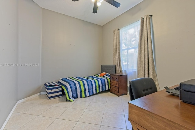 bedroom with light tile patterned floors, baseboards, and ceiling fan