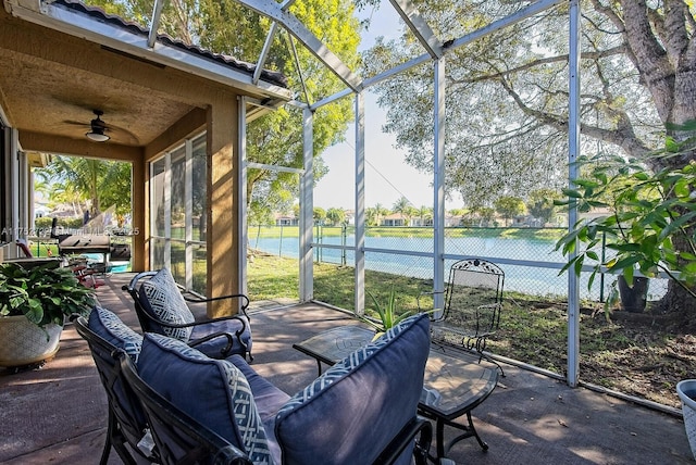 sunroom / solarium with a healthy amount of sunlight and ceiling fan