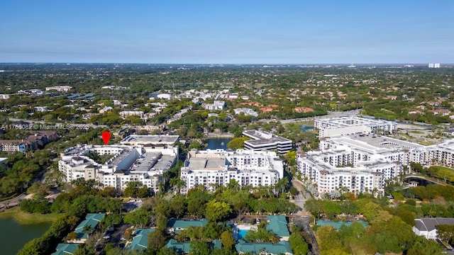 birds eye view of property with a city view and a water view
