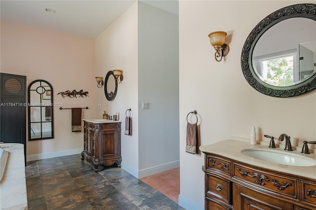 12301 SW 107th Ave, Miami, FL 33176 - bathroom featuring baseboards, stone finish floors, and two vanities