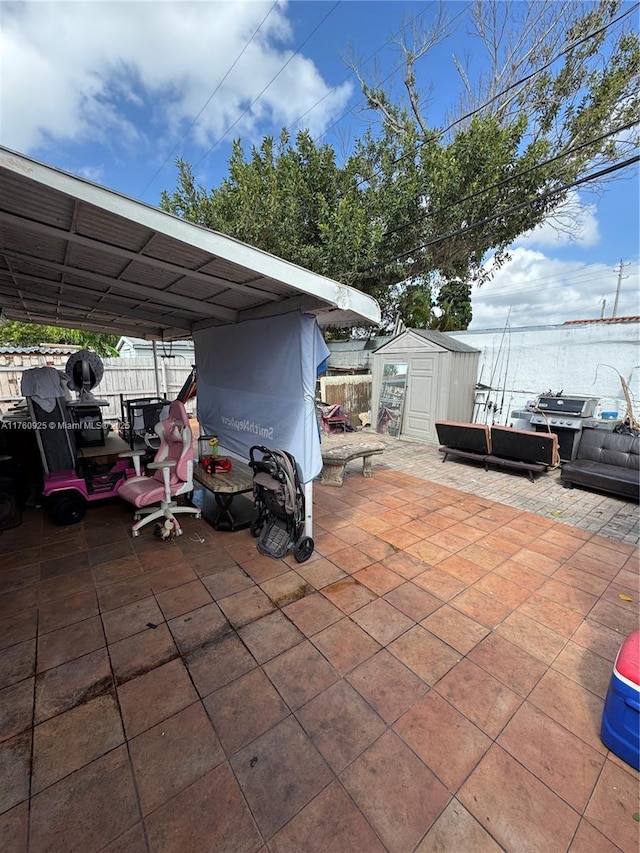 825 E 9th Ln, Hialeah, FL 33010 - view of patio with fence, a storage shed, and an outbuilding