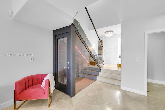 staircase featuring baseboards