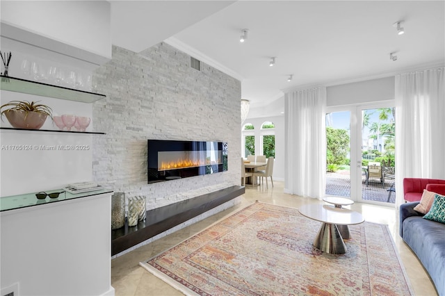 tiled living area with a fireplace and ornamental molding