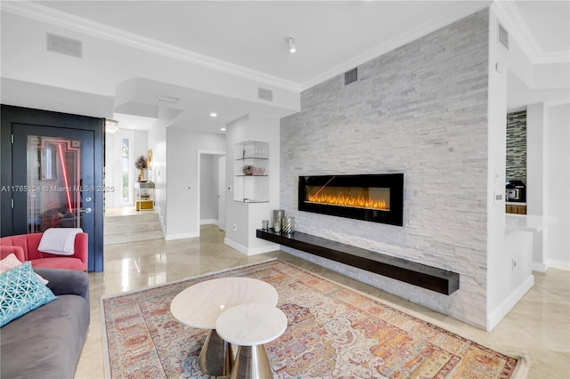 living area with visible vents, a fireplace, and ornamental molding