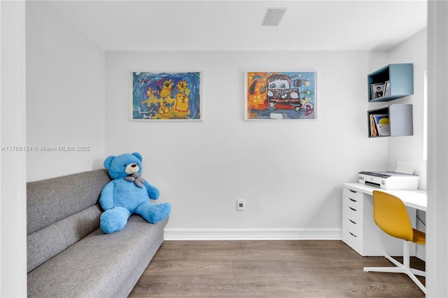 office with visible vents, wood finished floors, and baseboards