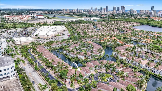 birds eye view of property featuring a residential view, a view of city, and a water view