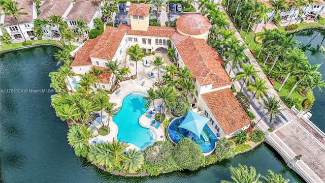 birds eye view of property with a water view and a residential view