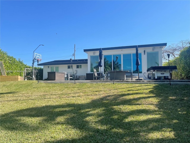 8841 SW 54th St, Miami, FL 33165 - rear view of house with a yard and stucco siding