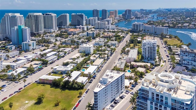 birds eye view of property featuring a view of city and a water view