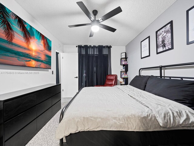 bedroom featuring a textured ceiling and ceiling fan