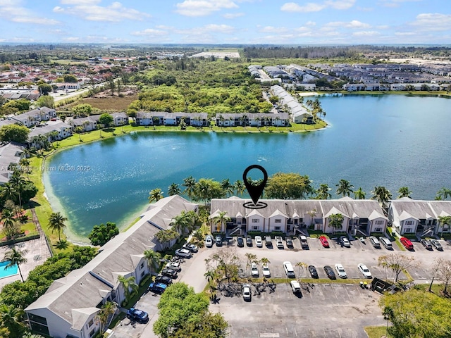 birds eye view of property with a water view