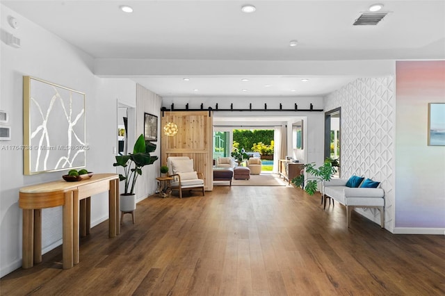 foyer featuring wood finished floors, baseboards, and recessed lighting