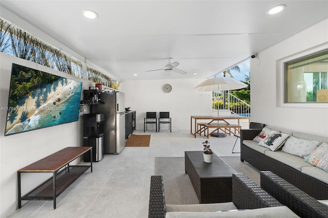 view of patio with an outdoor living space and a ceiling fan