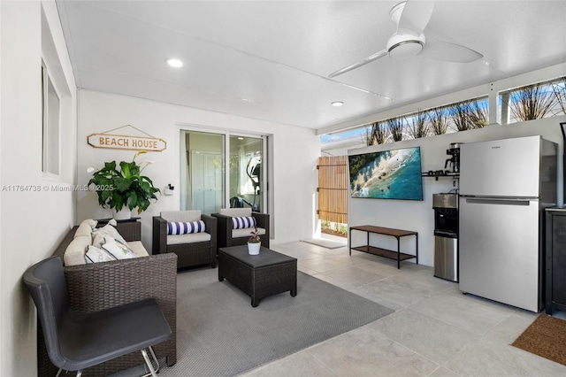 tiled living room with recessed lighting and ceiling fan