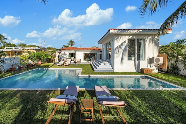 7770 Hawthorne Ave, Miami Beach, FL 33141 - rear view of house featuring stucco siding and a cooling unit
