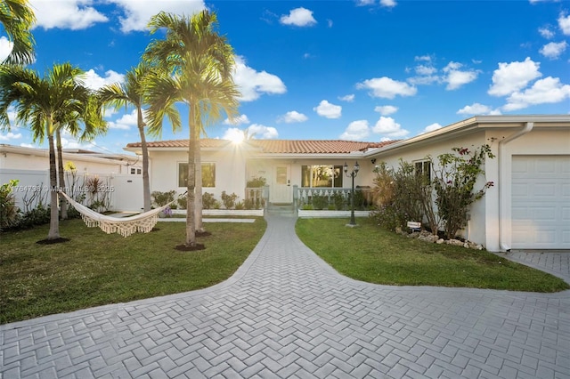 view of front of house with stucco siding and a tile roof