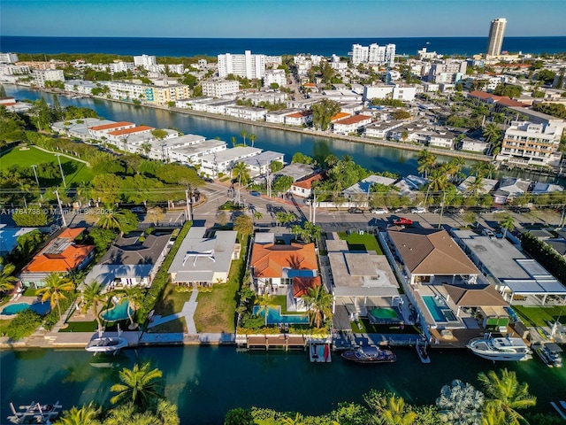 aerial overview of property's location with a nearby body of water and nearby urban area